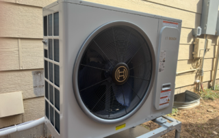 Modern air source heat pump installed outside a Decatur Georgia home